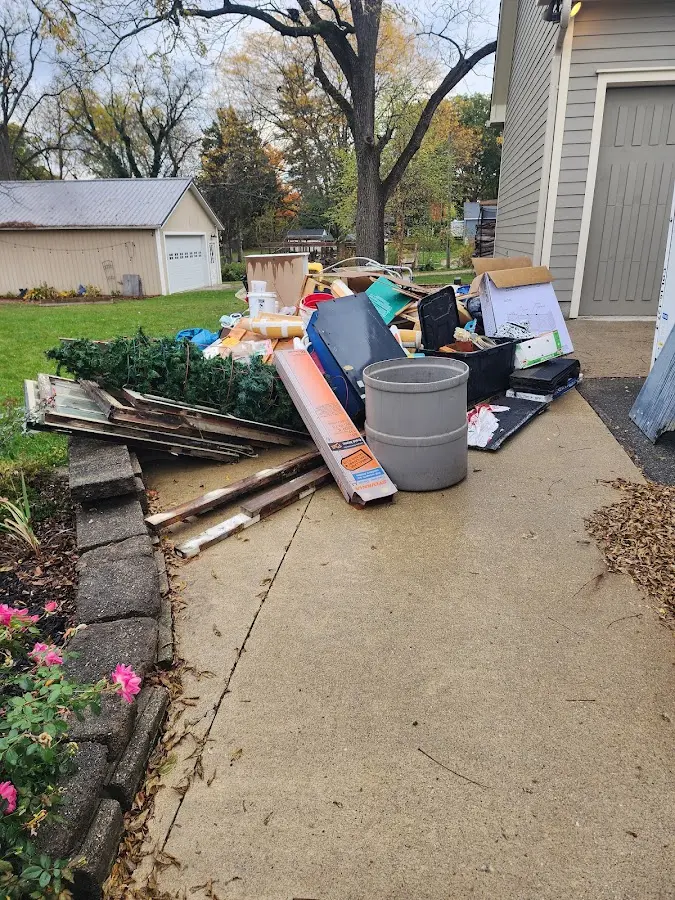 Dumpster being loaded with debris for Residential Dumpster Rental in Boca Raton